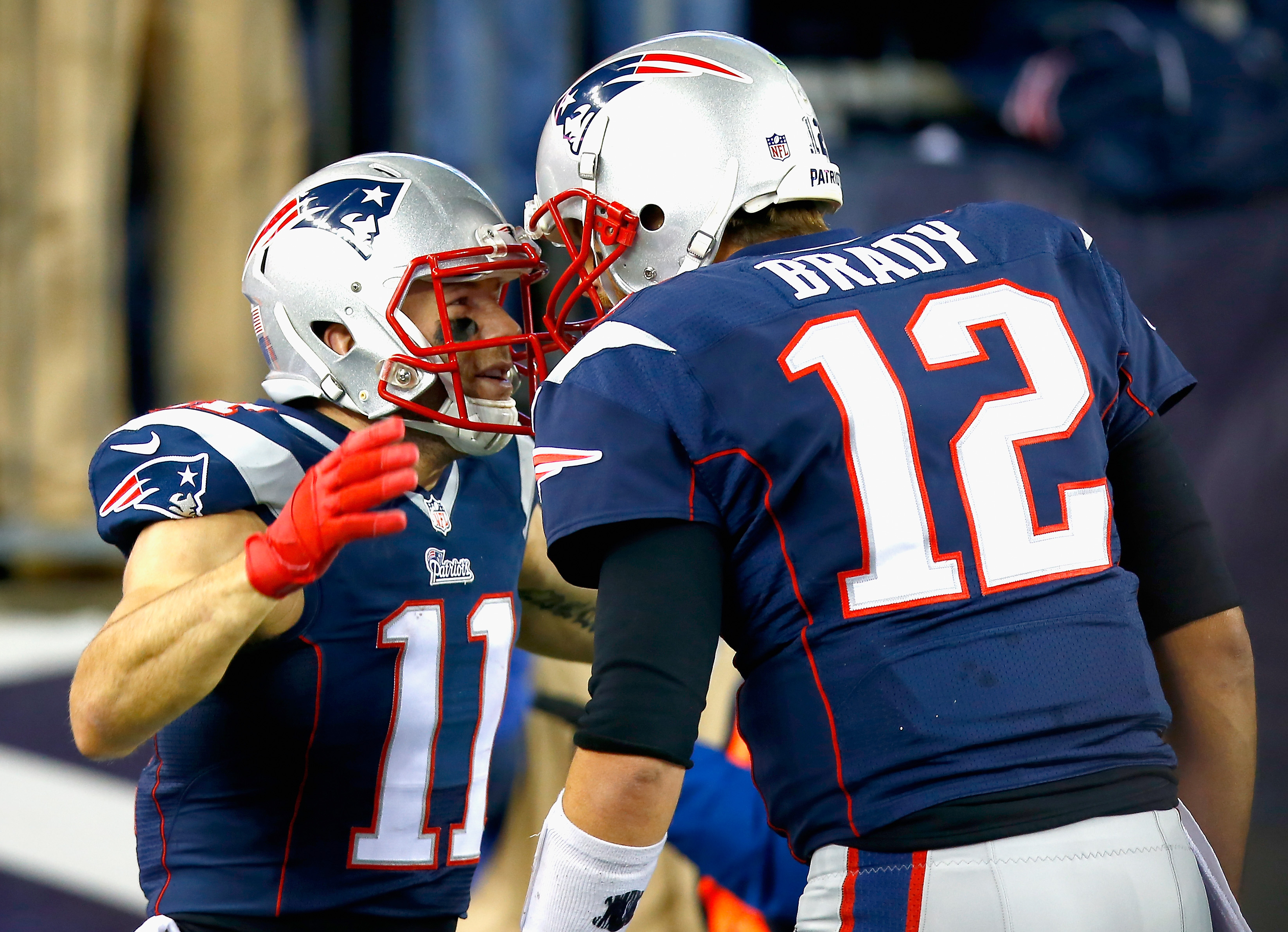 FOXBORO, MA - NOVEMBER 02: Julian Edelman #11 of the New England Patriots reacts alongside Tom Brady #12 after returning a kick for a touchdown during the second quarter against the Denver Broncos at Gillette Stadium on November 2, 2014 in Foxboro, Massachusetts. (Photo by Jared Wickerham/Getty Images)