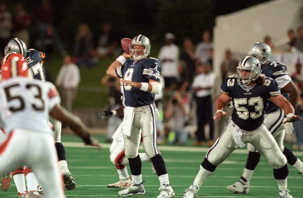 Dallas Cowboys quarterback Troy Aikman (8) throws in the pocket with protection from center Mark Stepnoski (53) against the Cleveland Browns.