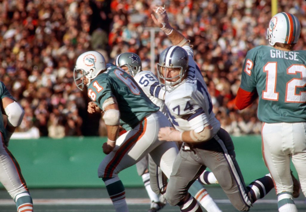 Dallas Cowboys defensive tackle (74) Bob Lilly rushes Miami Dolphins quarterback (12) Bob Griese during Super Bowl VI at Tulane Stadium. 